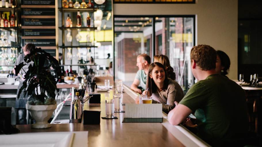 Friends enjoy a drink at EaTo's bar in Minneapolis.
