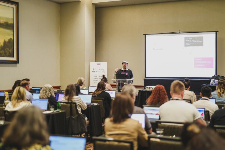 A speaker leading a session at the Tourism Academy conference